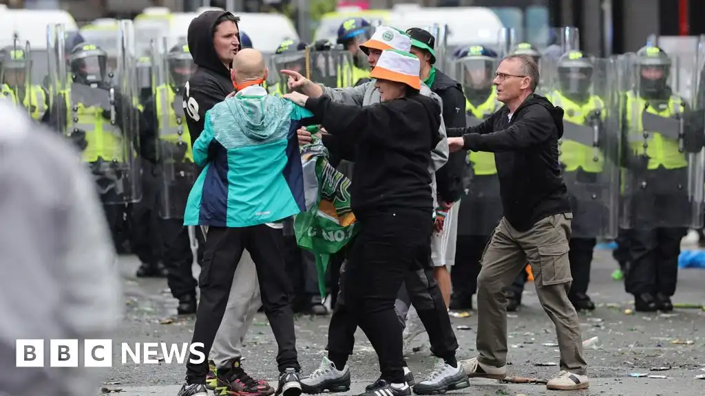 Police pelted with bottles as Celtic fans celebrate Scottish Premiership title