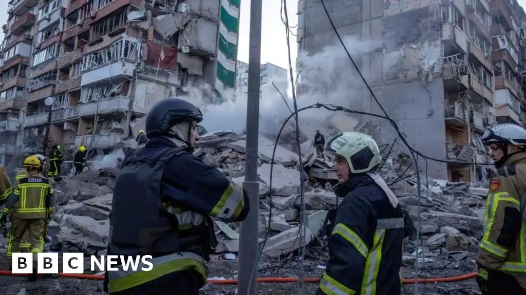 Rescuers search rubble of Kyiv flats after massive Russian strikes kill two